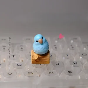 Exquisite handcrafted resin Blue Parrot Keycap, a vibrant sculptural art piece for MX boards, showcasing intricate detail.