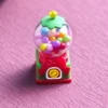 Handcrafted nostalgic candy machine keycap, a vibrant resin art piece, shown from various artistic angles with intricate retro details.