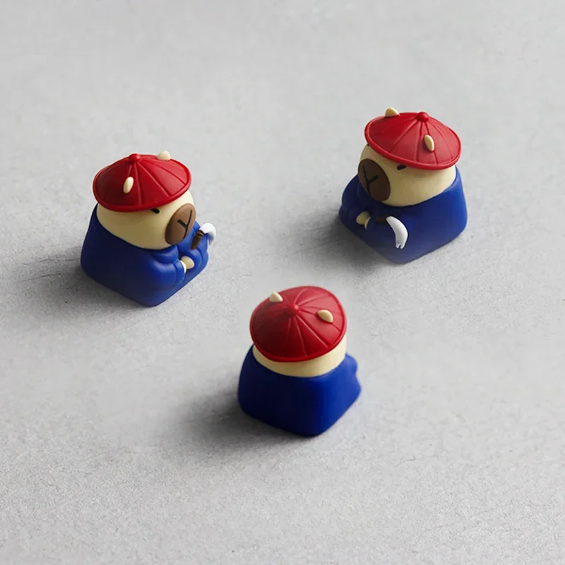 A collection of detailed views showcasing the handcrafted resin Capybara Servant Keycap, highlighting its charming 3D sculpted capybara from various angles.