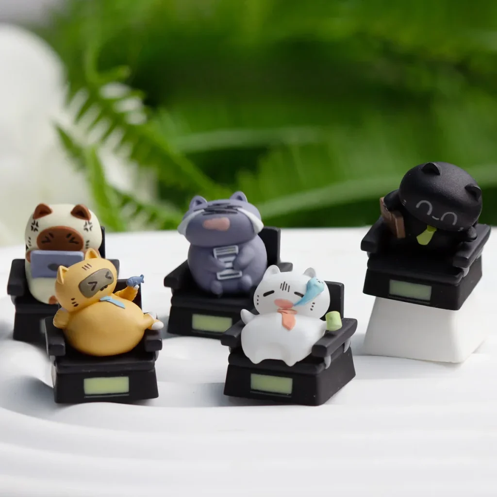 Charming handcrafted resin Cat Worker artisan keycap for ESC, featuring a playful sculpted cat figure in a relatable office scenario.