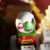 Multiple views of a handcrafted artisan Christmas crystal ball resin keycap, revealing its intricate miniature Christmas wonderland from diverse artistic.
