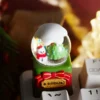 Handcrafted artisan Christmas crystal Ball keycap, showcasing a detailed miniature festive wonderland scene encased within clear spherical resin.