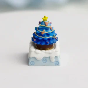 Artistic handcrafted resin Christmas ESC artisan keycap, featuring a blue winter wonderland and festive elements encased in clear resin, visible from few angles.