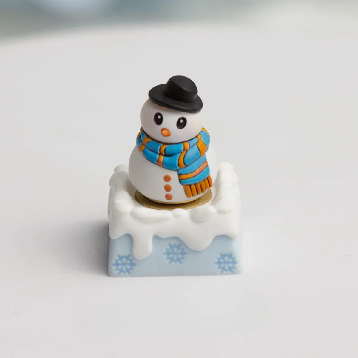 A collection of detailed views of the handcrafted blue resin Christmas artisan ESC keycap, revealing its intricate festive winter wonderland design.