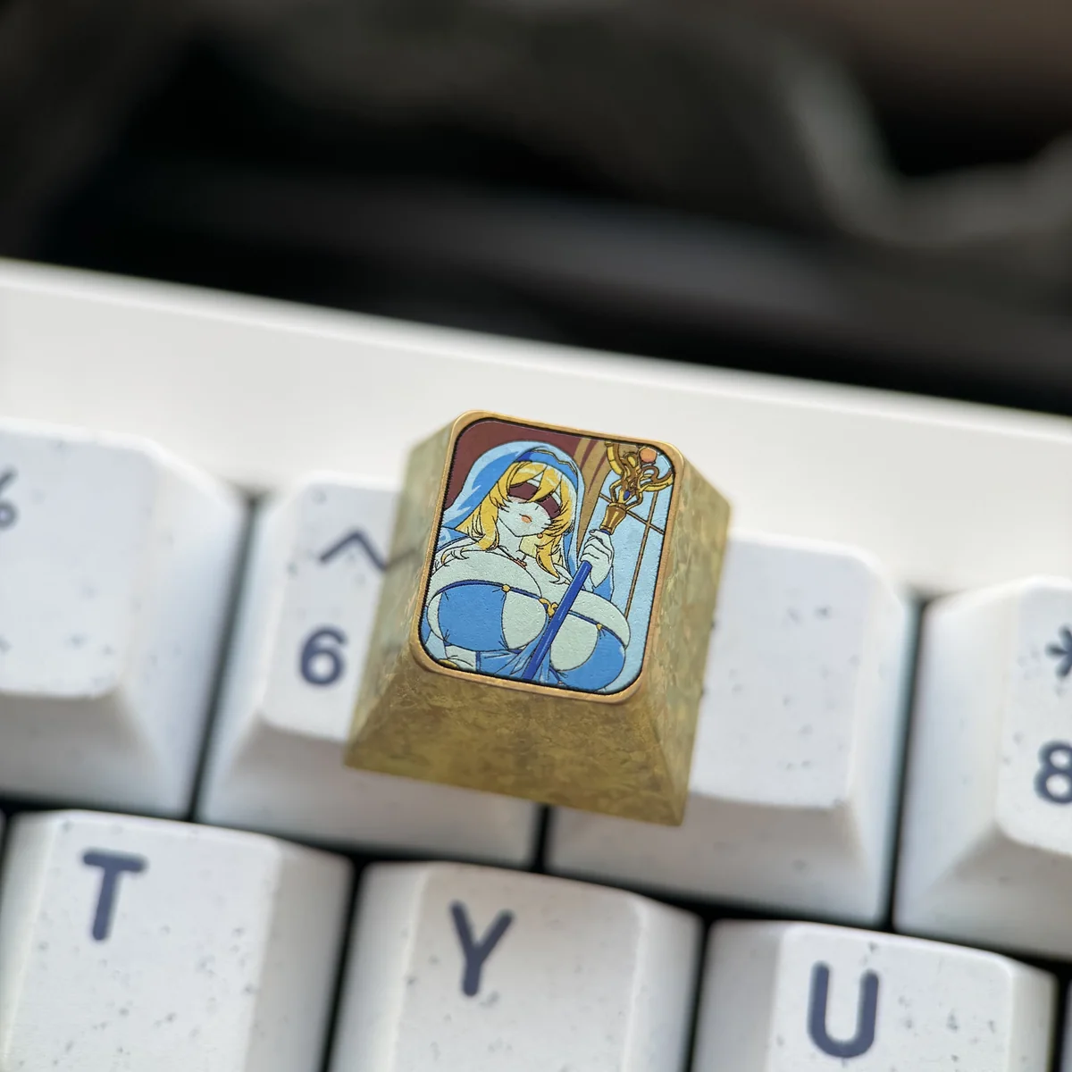 Close-up detail of the artisan Sword Maiden ESC key, highlighting its superior metal craftsmanship.