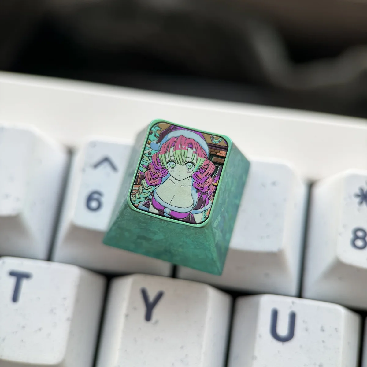 Premium titanium Mitsuri Kanroji Demon Slayer keycap gallery, showcasing its vibrant pink and green artisan design and metallic finish from multiple angles.