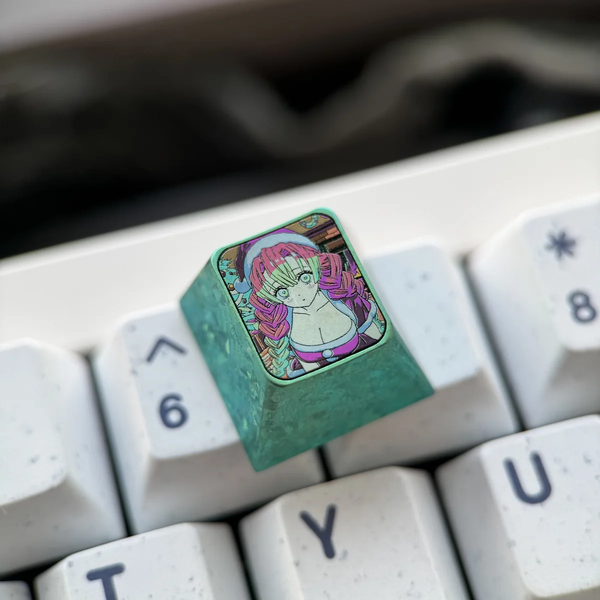Premium titanium Mitsuri Kanroji Demon Slayer keycap from multiple angles, highlighting its vibrant pink, green, and metallic artisan finish.