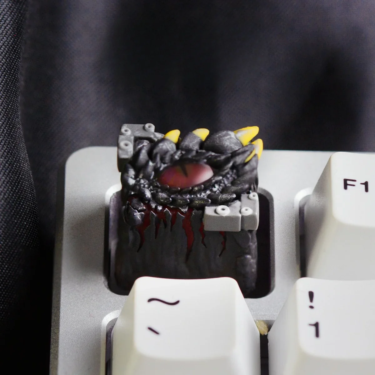 Handcrafted resin Mystical Dragon Eye keycap. See the translucent, glowing reptilian eye and intricate dark fantasy scales from multiple angles.