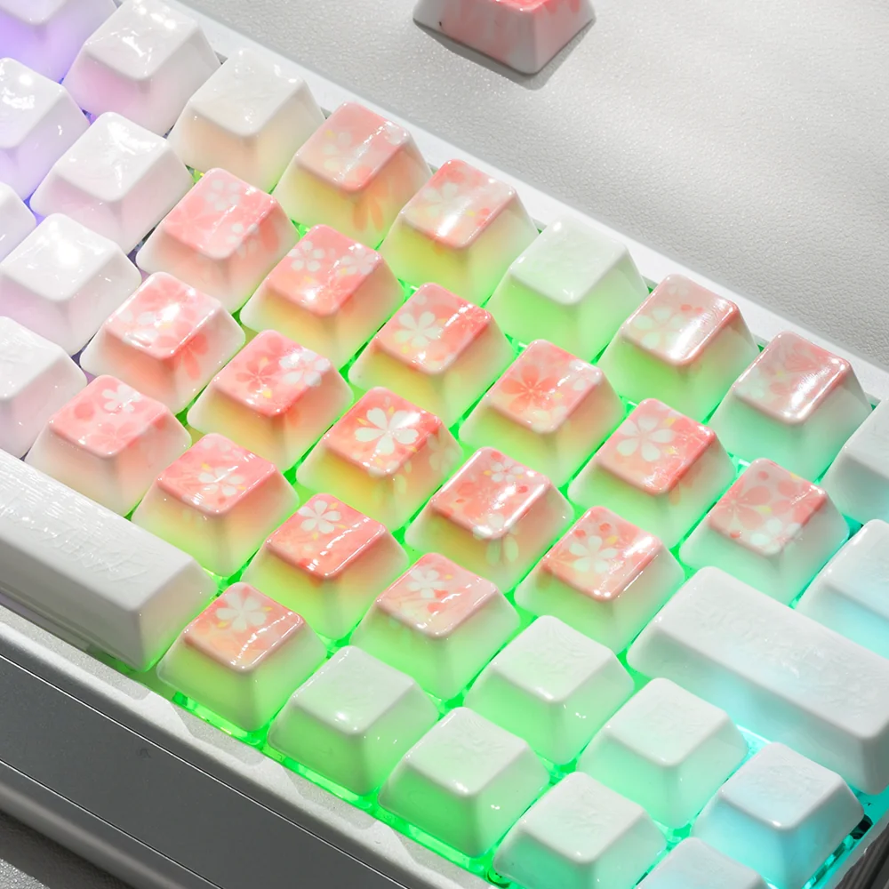 Decorative heart-shaped keycaps showcasing delicate cherry blossom and butterfly art.