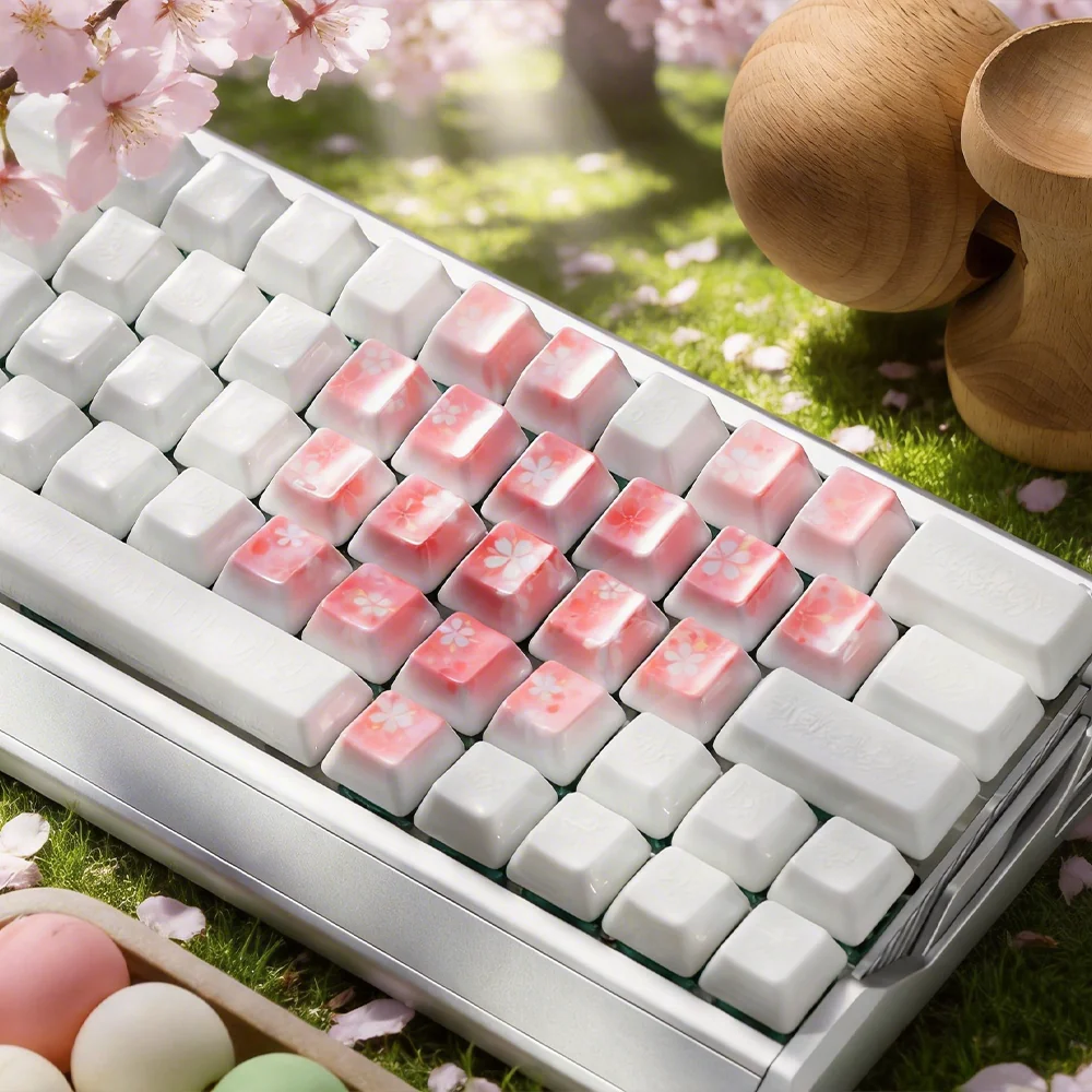 Handcrafted ceramic keycaps with ethereal cherry blossom and butterfly details.