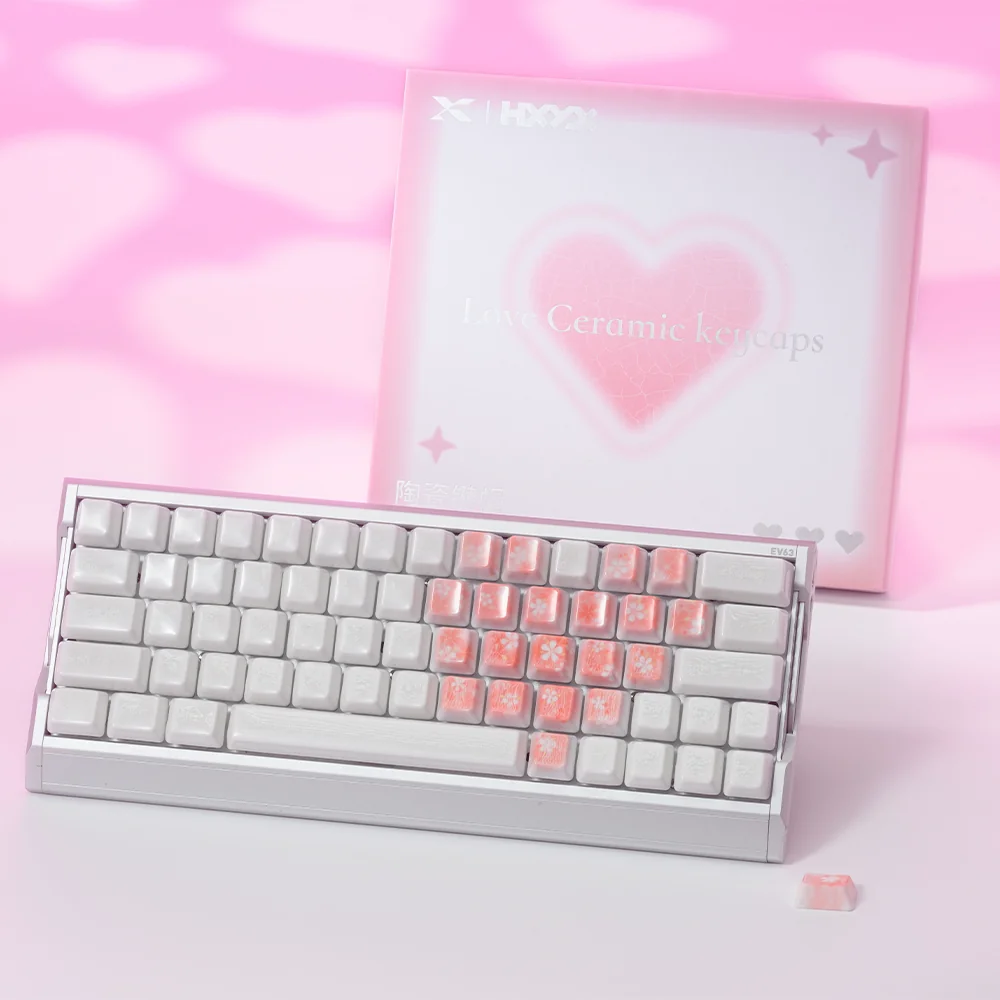 Detailed view of artisan translucent ceramic keycaps with cherry blossoms and butterflies.
