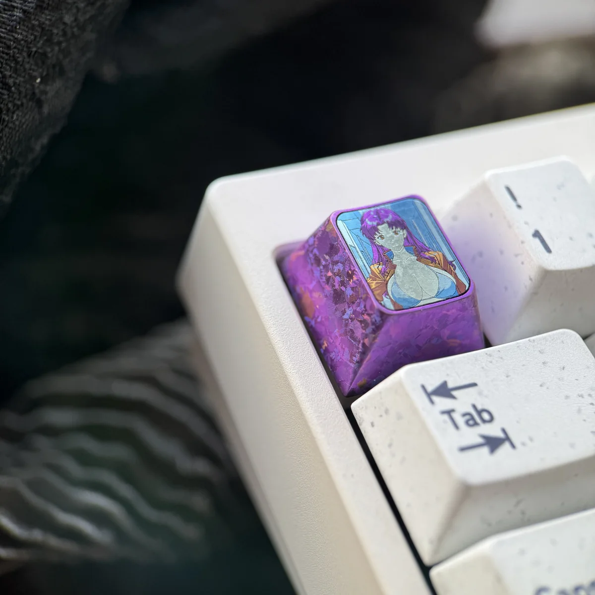 Multiple perspective shots of the NGE Misato Katsuragi titanium ESC key, emphasizing its unique design and premium material.