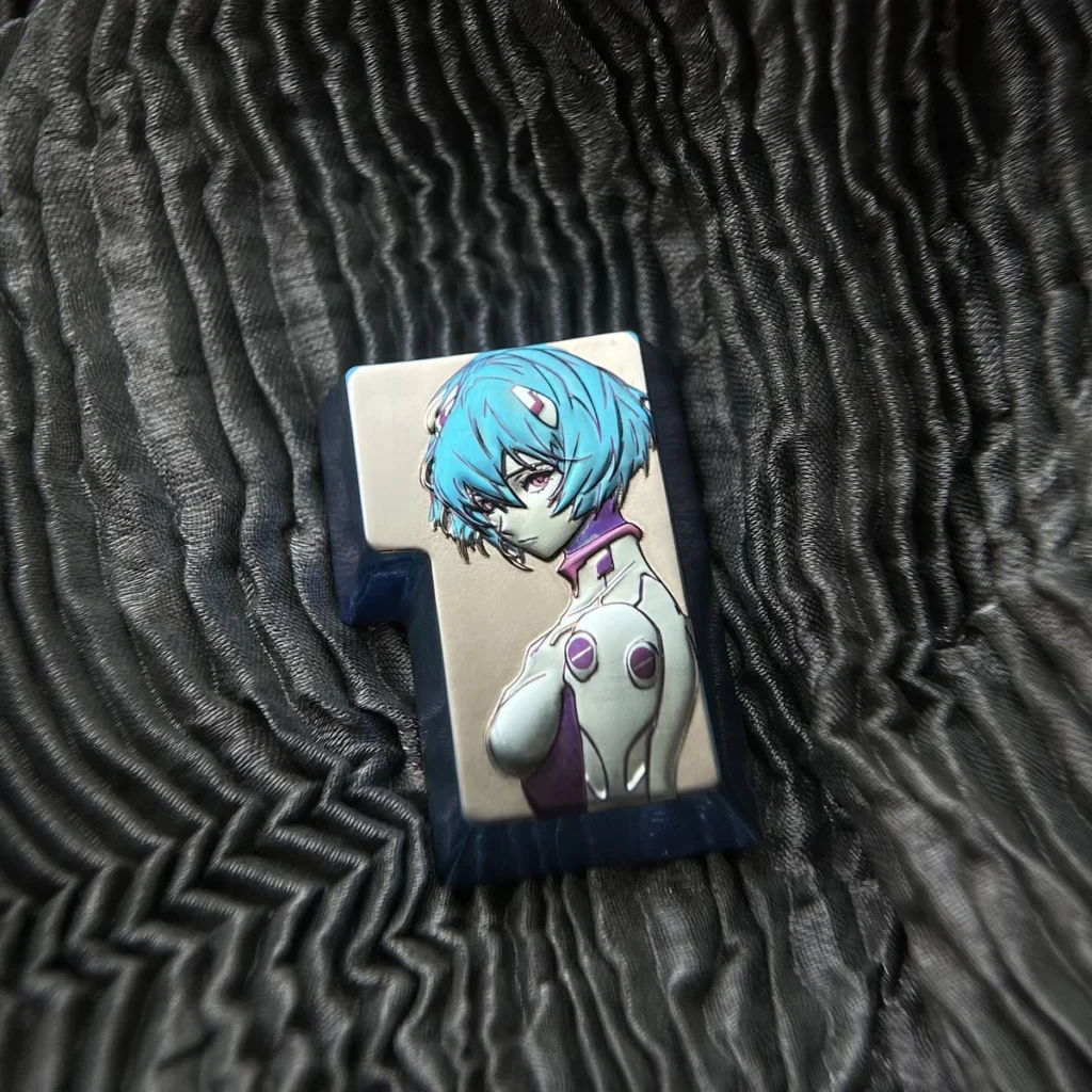 Evangelion Rei Ayanami titanium 3D custom enter key for mechanical keyboards, highlighting the detailed anime character sculpture and metallic sheen.