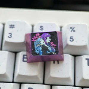 Premium Frieren Fern titanium artisan keycap, prominently displaying intricate anime character designs on anodized titanium. A stunning Frieren keycap.