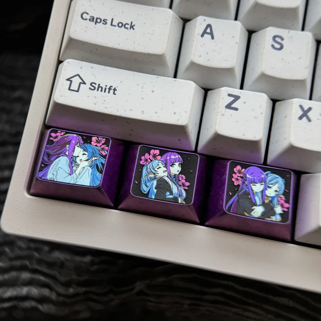 Premium Frieren Fern titanium artisan keycap, prominently displaying intricate anime character designs on anodized titanium. A stunning Frieren keycap.