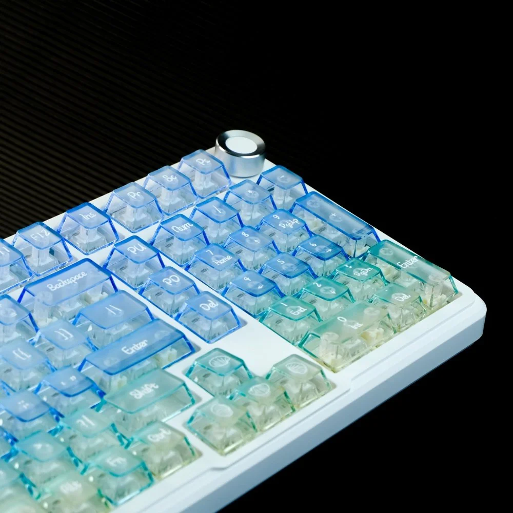 Frosted PC Keycaps Set, gradient translucent blue-white. Ocean-inspired, ethereal, light-diffusing summer aesthetic from varied angles.