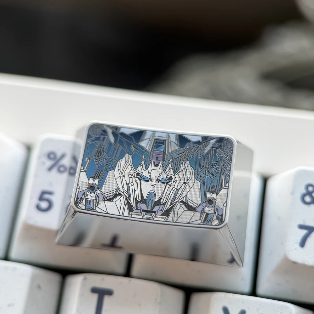 Gundam Titanium Keycap product gallery showcasing its aerospace-grade titanium, iconic mecha design, and futuristic industrial metallic finish from multiple angles.