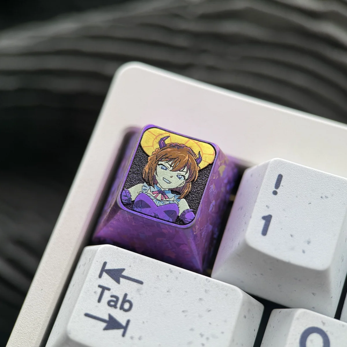 Collector's edition Haibara Ai titanium keycap, displaying intricate Detective Conan character art from several angles.