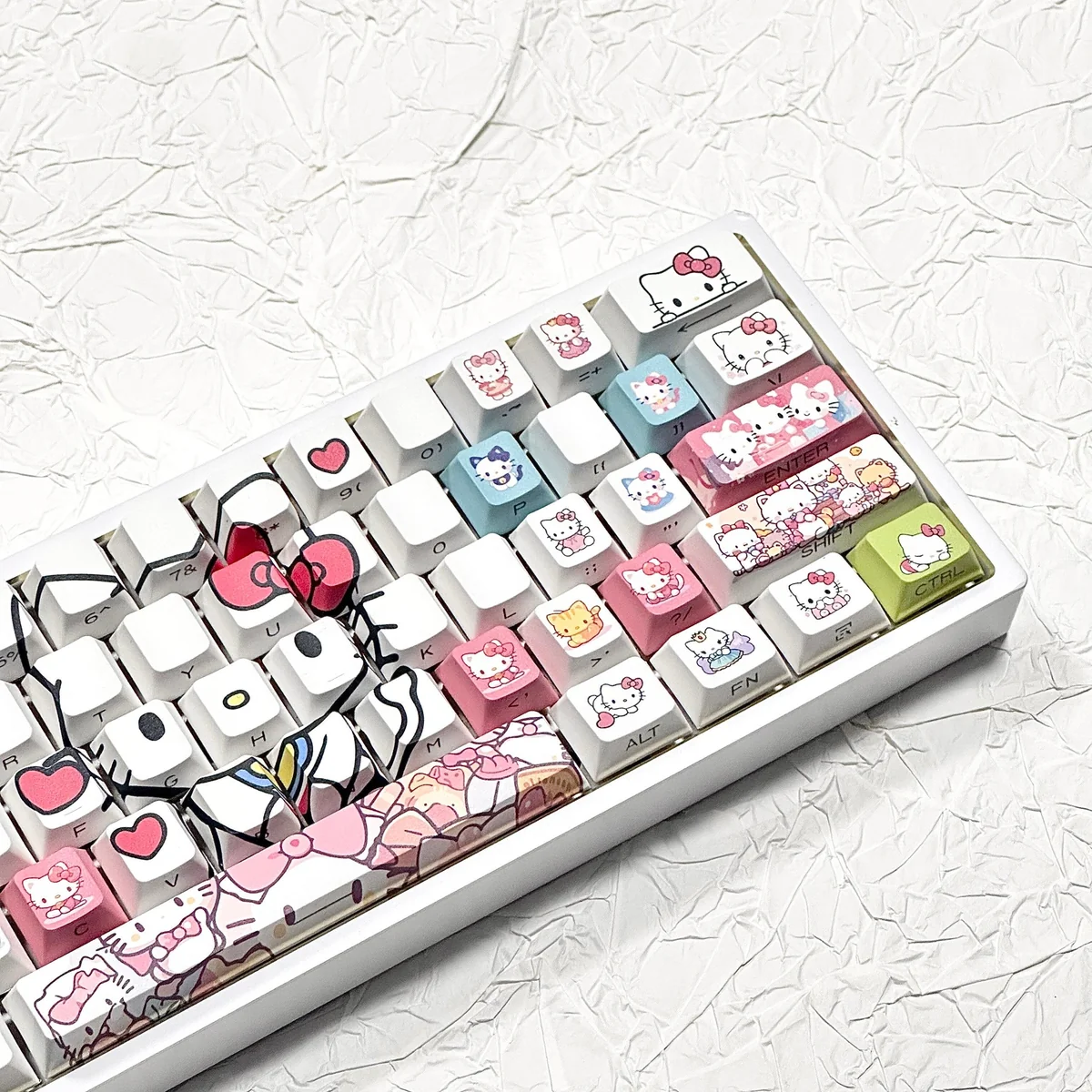 Playful Hello Kitty PBT side-lit keycaps set, shown from various angles. Highlights iconic designs, durable PBT, and clean side legends for vibrant RGB.