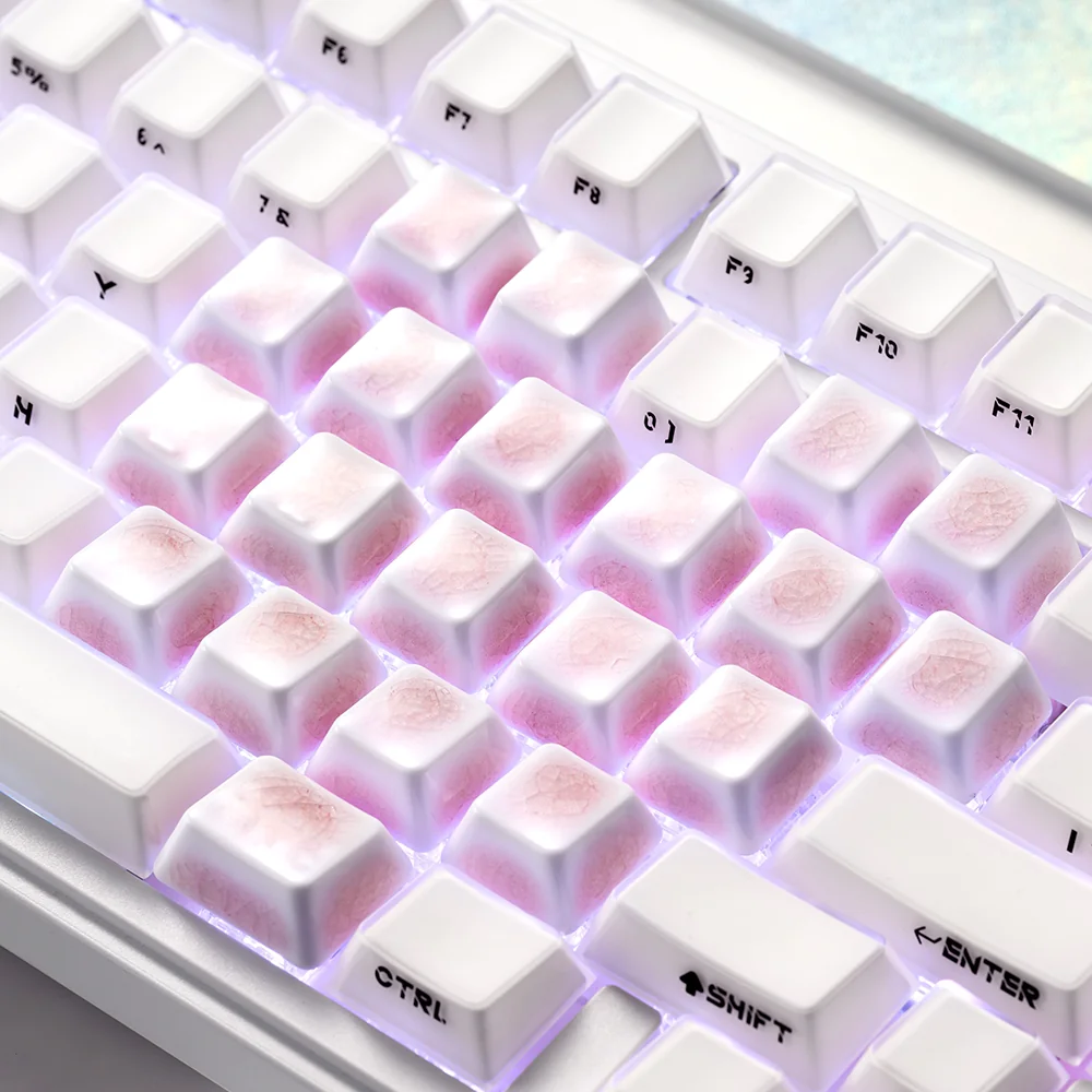 Collection of artisan pink heart keycaps, each made from ceramic with a distinct ice crack finish, ideal for custom keyboard builds.
