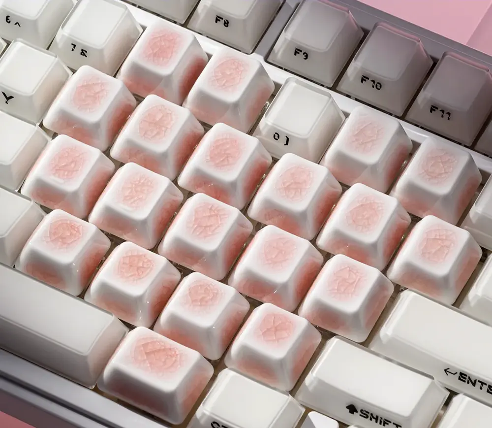 Assortment of unique pink ceramic keycaps with heart and ice crack designs, perfect for adding a touch of elegance to any MX compatible keyboard.