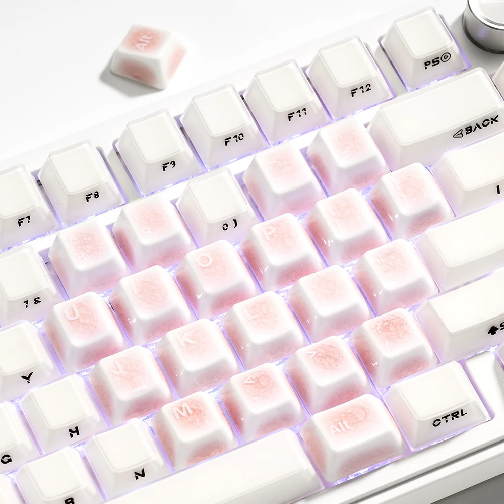 Complete 21-key set of handcrafted pink ceramic heart keycaps, showcasing the intricate ice crack texture for a personalized keyboard aesthetic.