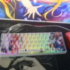 Kamio Misuzu AIR side-print backlit PBT keycaps set, showcasing various angles of their serene skies and gentle wing art, with clear, illuminated legends.