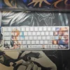 Close-up of Kamio Misuzu AIR PBT keycaps set, showcasing the elegant side-printed legends and gentle backlighting, capturing the anime's serene aesthetic.