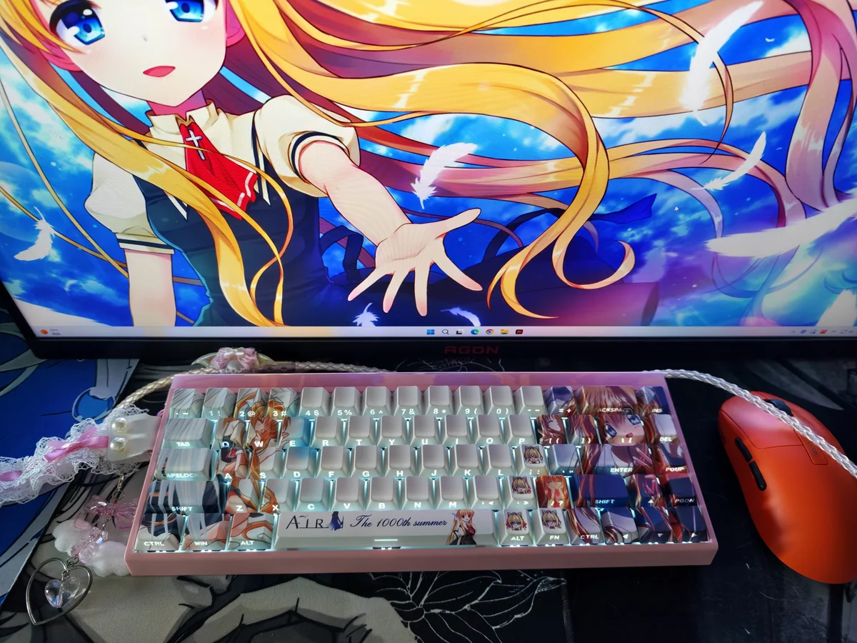 A gallery view of Kamio Misuzu AIR side-print backlit PBT keycaps set, displaying their delicate design and serene, winged motifs from various angles.
