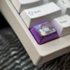 Multiple views of the premium Kurumi Tokisaki titanium keycap, showcasing vibrant Date A Live anime art and its durable metallic finish from various angles.