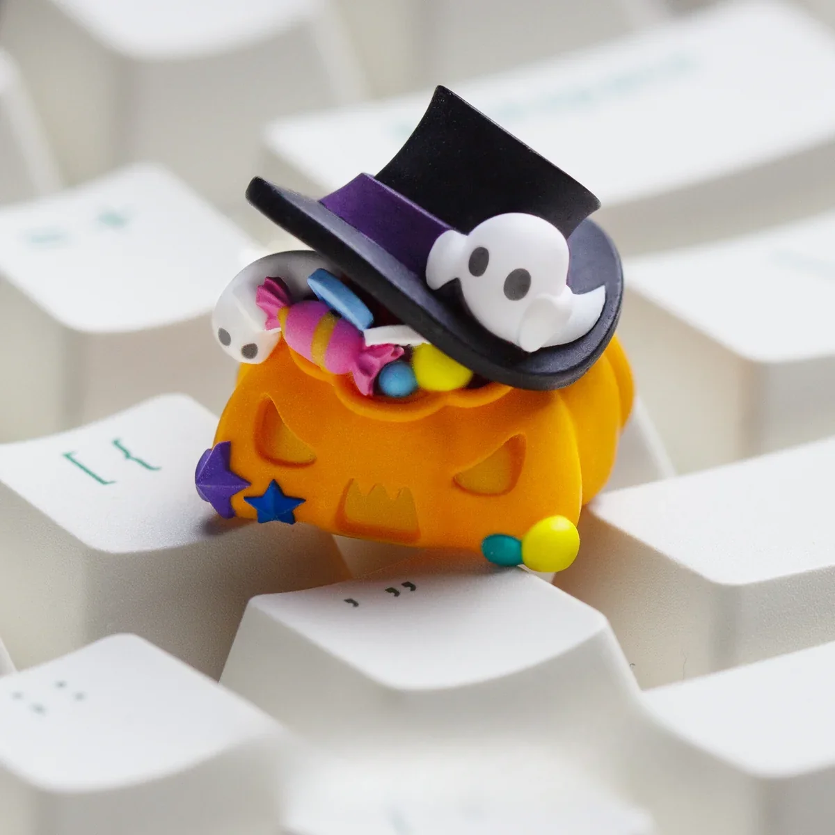 A collection of angles for a handcrafted luminous resin Halloween ESC keycap, highlighting charming glowing pumpkin artwork and translucent amber hues.