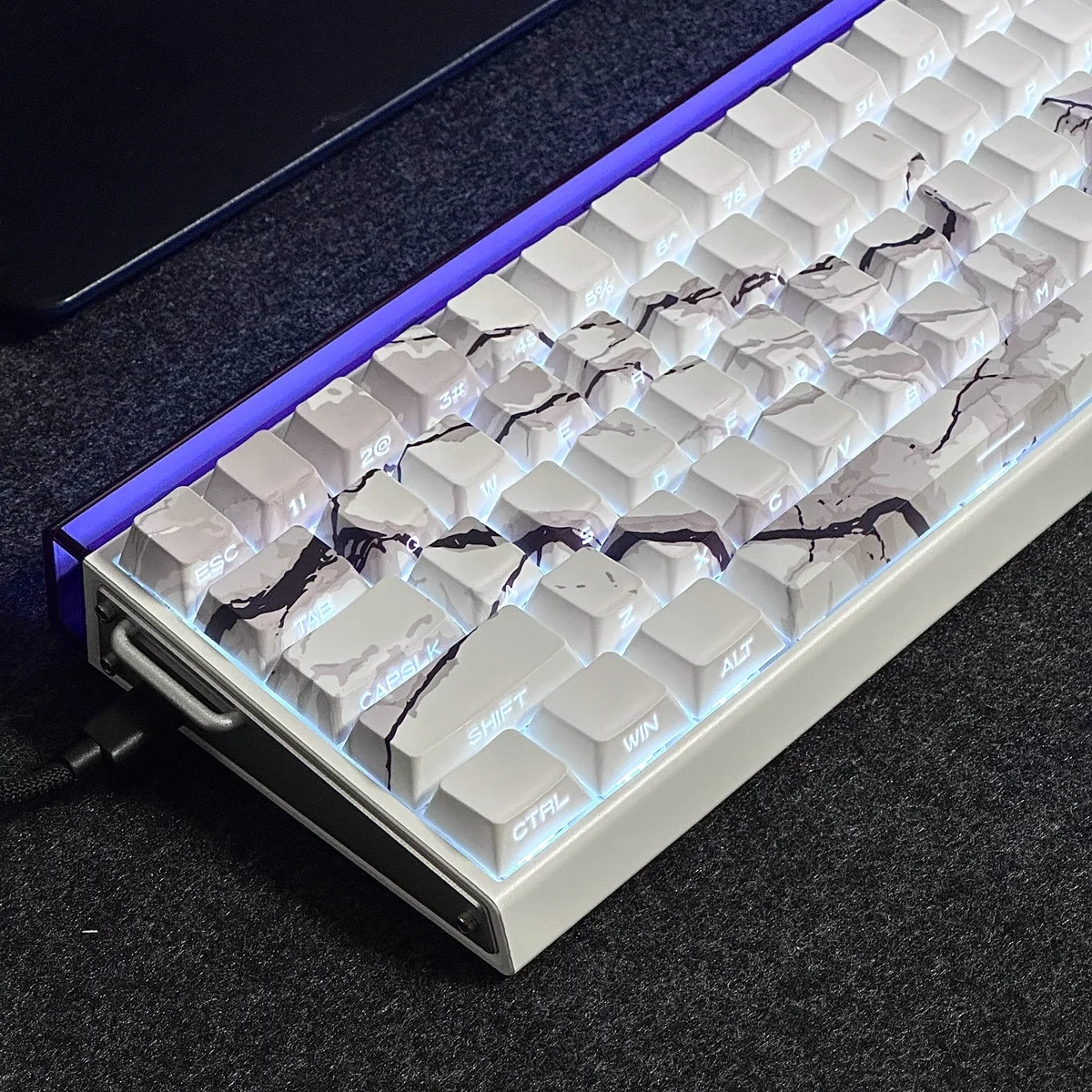 Detailed views of the Side-Lit PBT Marble Keycap Set, highlighting the unique natural marble texture and crisp side-engraved legends with subtle backlit.