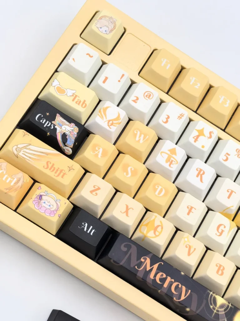Exquisite Overwatch Mercy artisan keycap set, showcasing its angelic white and gold design from multiple elegant angles. A true masterpiece.