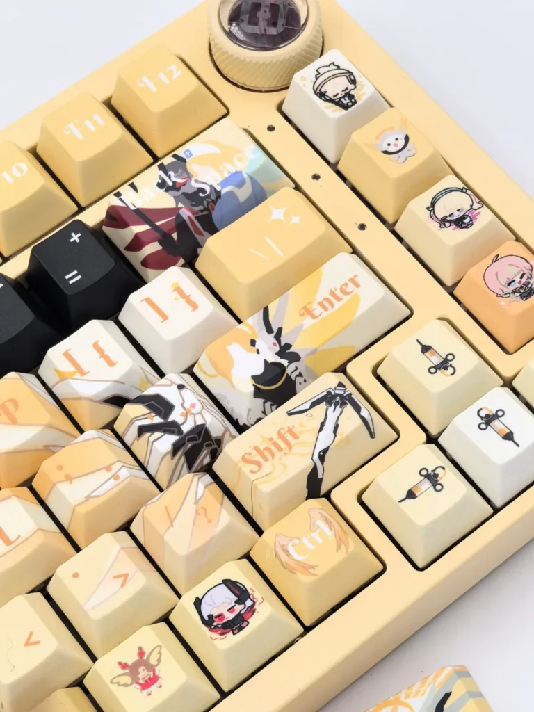 Exquisite Overwatch Mercy artisan keycap set showing its angelic white and gold design from multiple angles, highlighting its detailed craftsmanship.