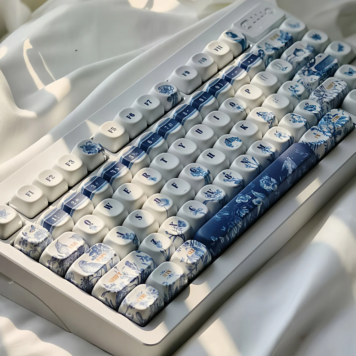 Angled view of ancient art PBT keyboard keycaps, featuring serene garden themes and fade-resistant dye-sublimation.