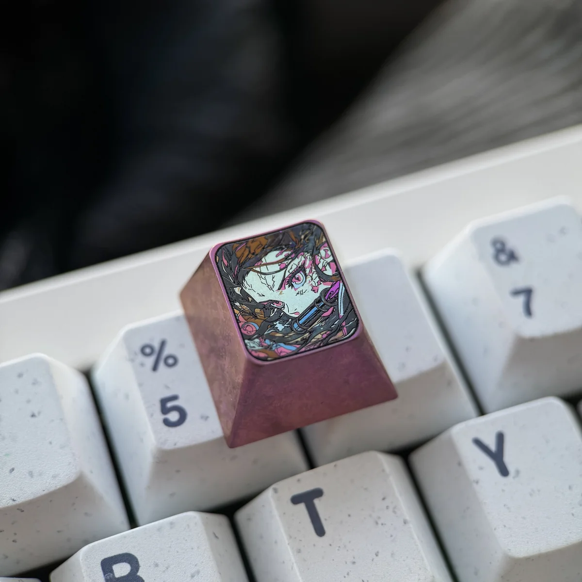 Artistic views of the handcrafted Nezuko Titanium ESC keycap, highlighting its intricate Demon Slayer details and premium, durable finish from various angles.
