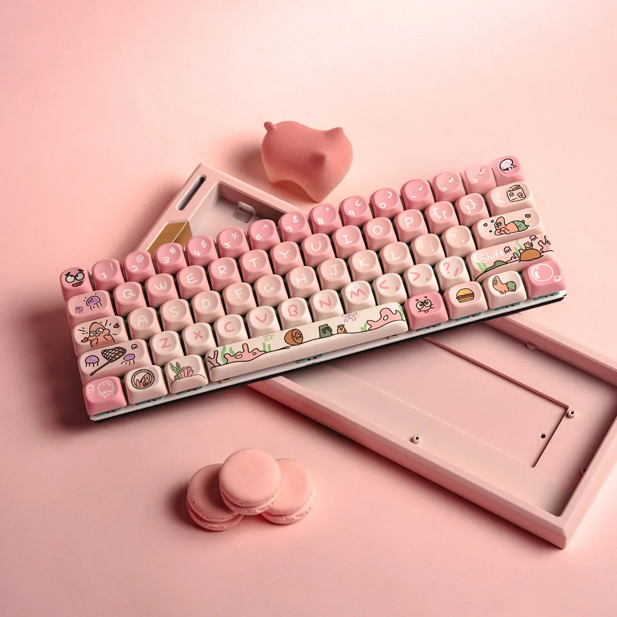 Whimsical Patrick Star PBT MOA keycap set at various angles, highlighting cute pink dye-sublimated designs and ergonomic MOA profile for playful desk.