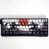 Artistic Sunset War PBT keycap set, showcasing durable side-printed legends with dramatic sunset hues and battle-worn graphics.