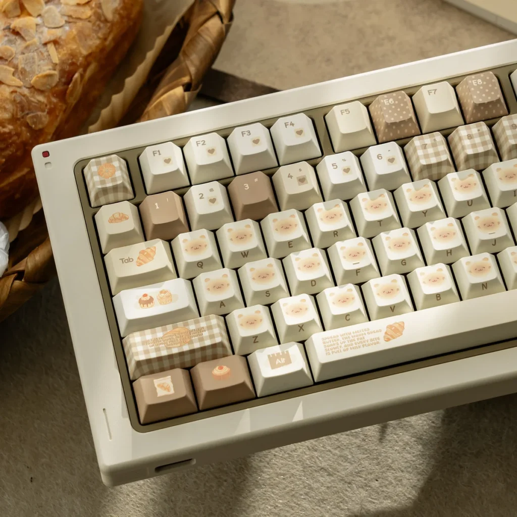 Close-up of Bakehouse Cherry Keycap Set showing unique side-engraved legends and warm toasted hues. Premium artistic design for a minimalist keyboard.