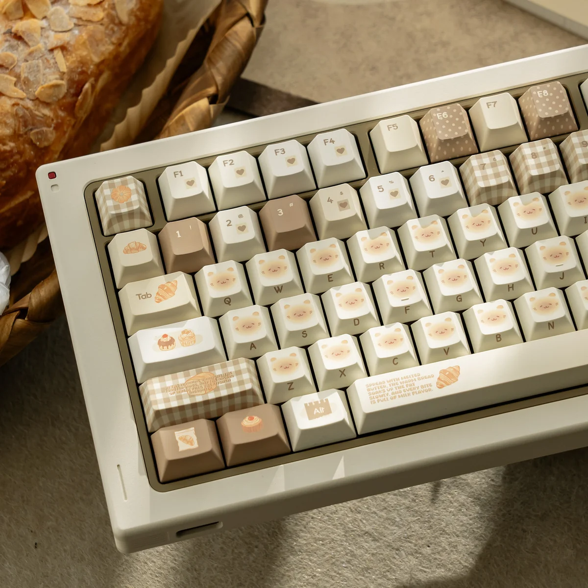 Close-up of Bakehouse Cherry Keycap Set showing unique side-engraved legends and warm toasted hues. Premium artistic design for a minimalist keyboard.