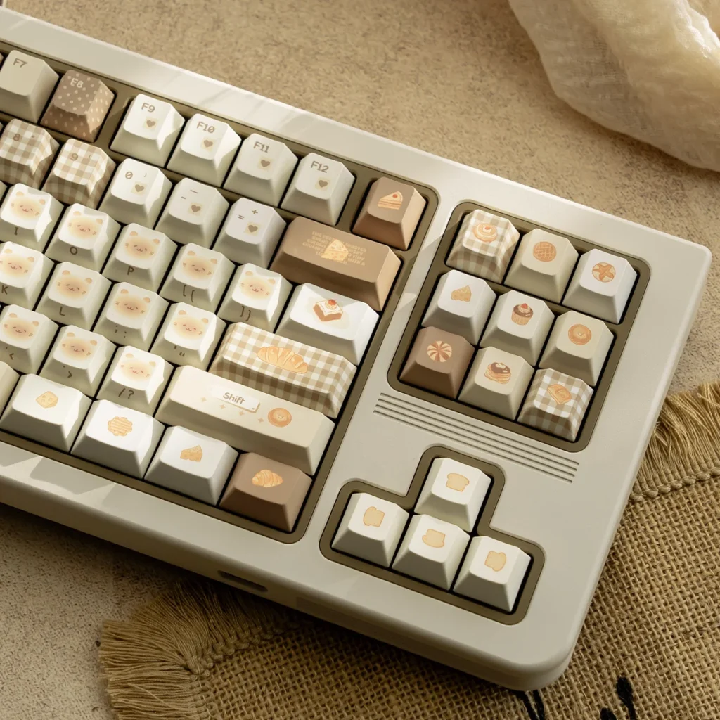 Bakehouse Cherry Keycap Set in various views, showcasing unique warm toasted hues and minimalist legends for a premium custom keyboard.