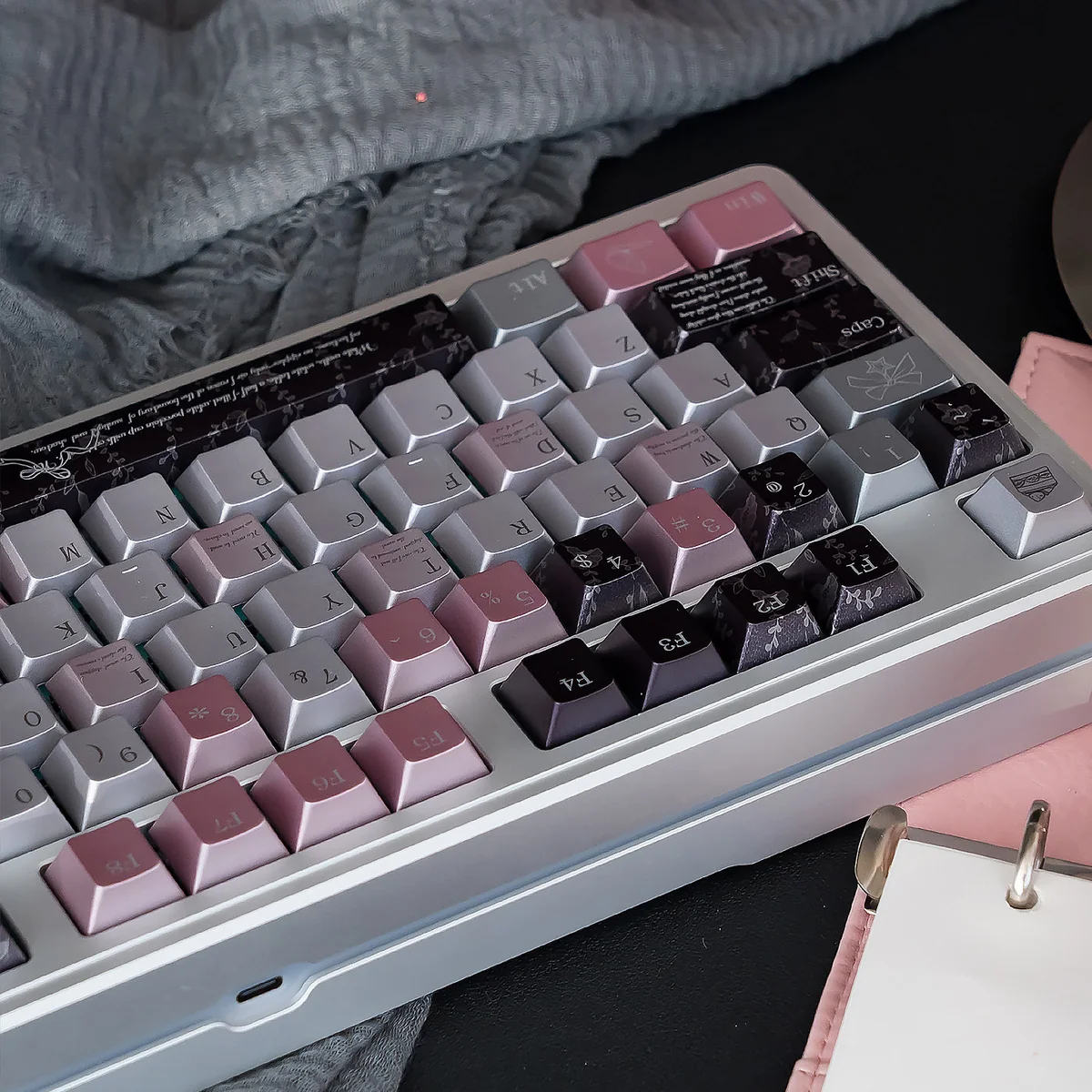 Close-up of the Mysterious Gauze Pink Dimple Aesthetic PBT Keycaps Set, showcasing the shimmering pearl metal finish and soft pink hues from an elegant design.