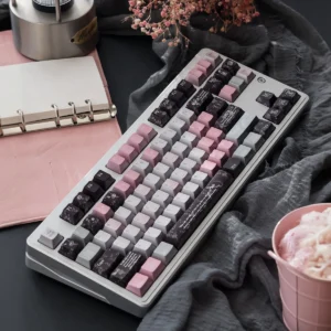 Aesthetic PBT keycaps set showcasing the unique Gauze Pink Dimple pearl metal finish against a deep, elegant backdrop.