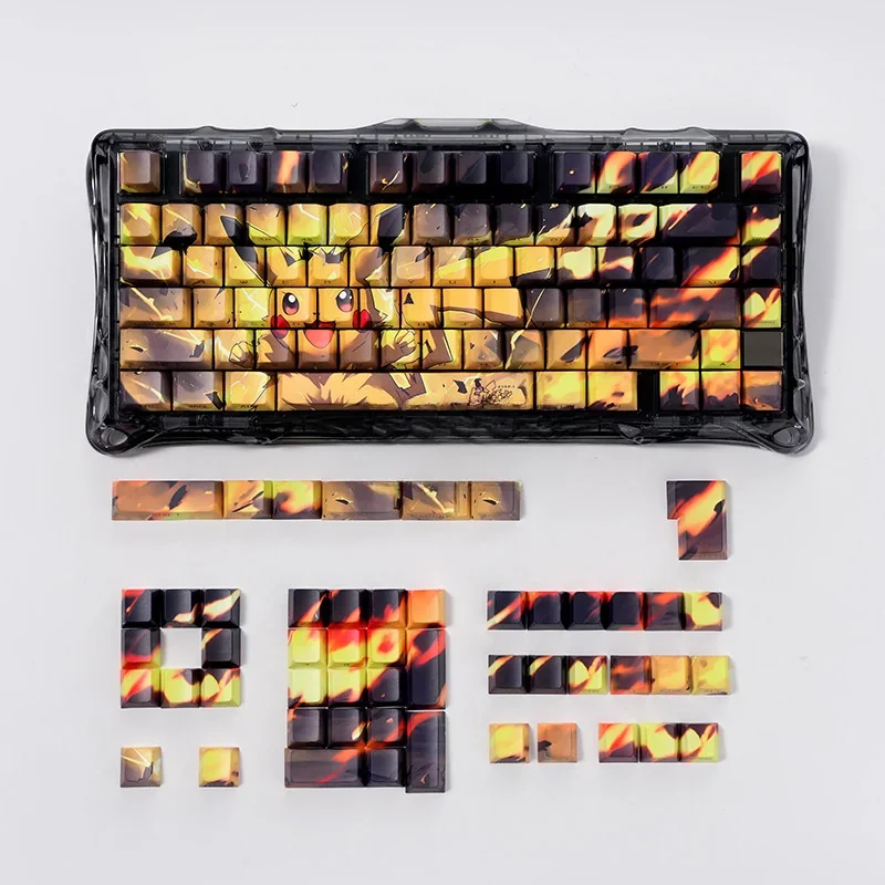 Detailed views of the iconic Pikachu PBT backlit keycap set, featuring vibrant yellow graphics and luminous side-engraved legends from various angles.