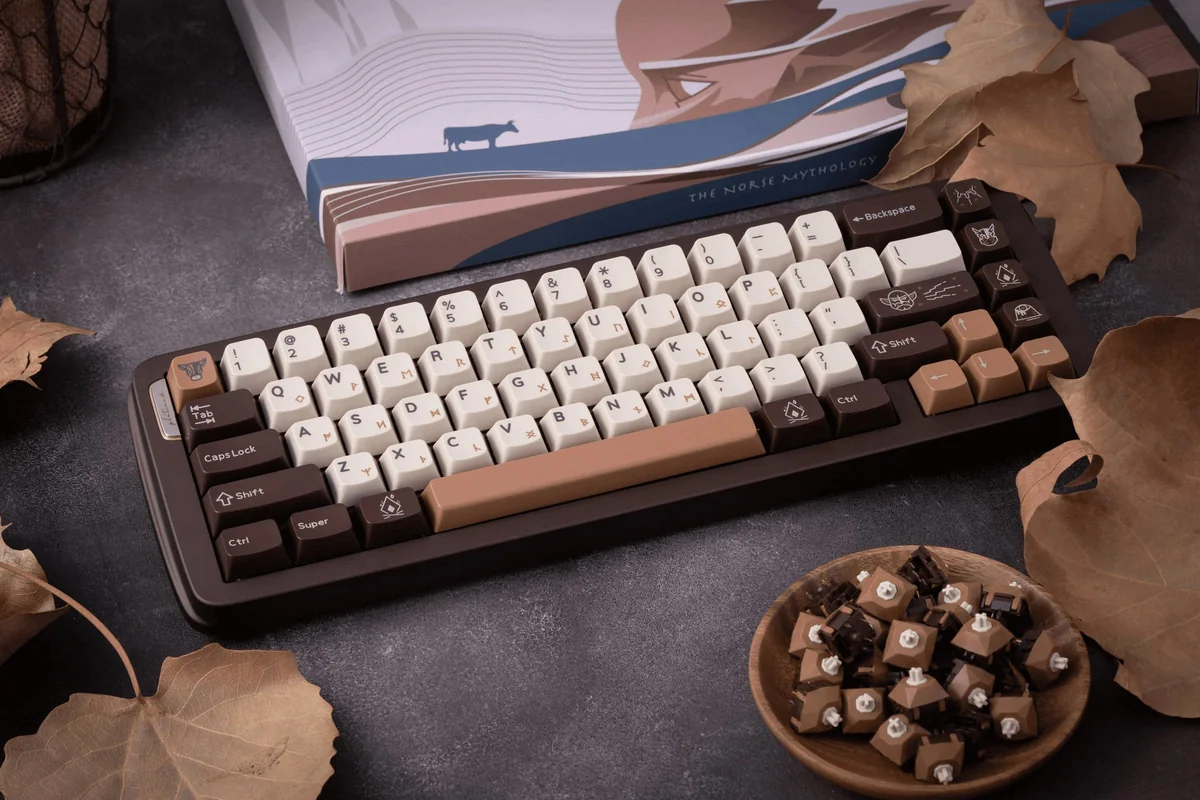 Close-up of Norse mythology artisan keycaps, showing detailed runes and divine symbols.