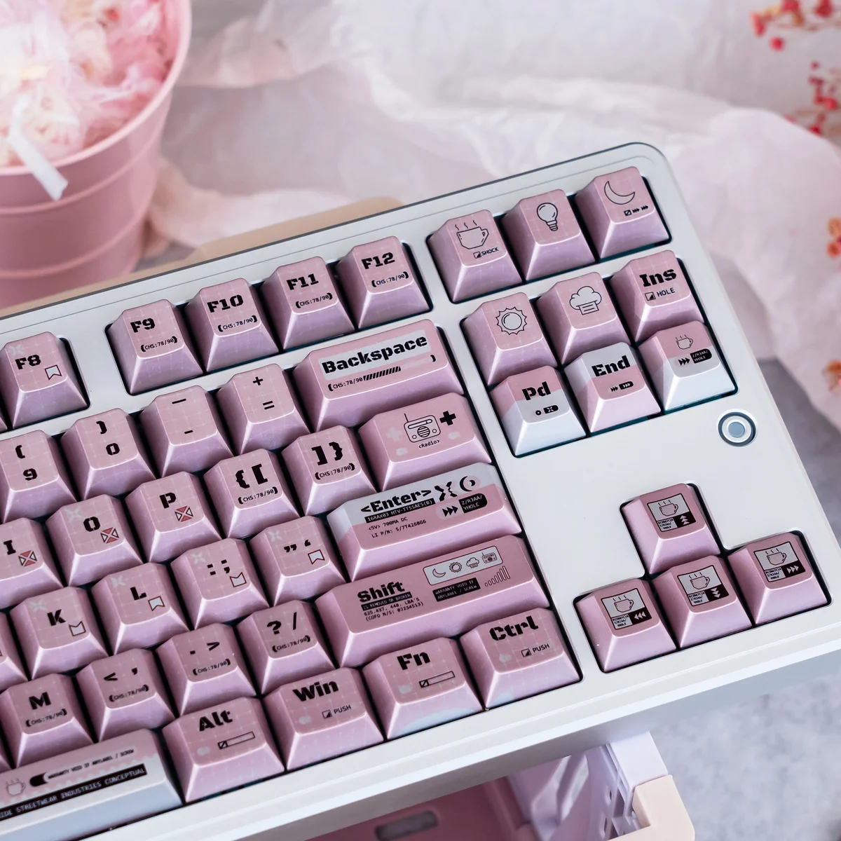 Close-up views of the Charming Programmer Keycap Set, highlighting its whimsical character design and radiant pearlescent shimmer from multiple angles.