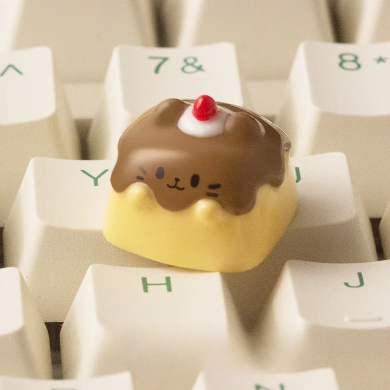 Handcrafted Pudding Cat Keycap from a new angle, revealing its whimsical resin art and translucent layers. This unique artisan ESC keycap features an unique design.