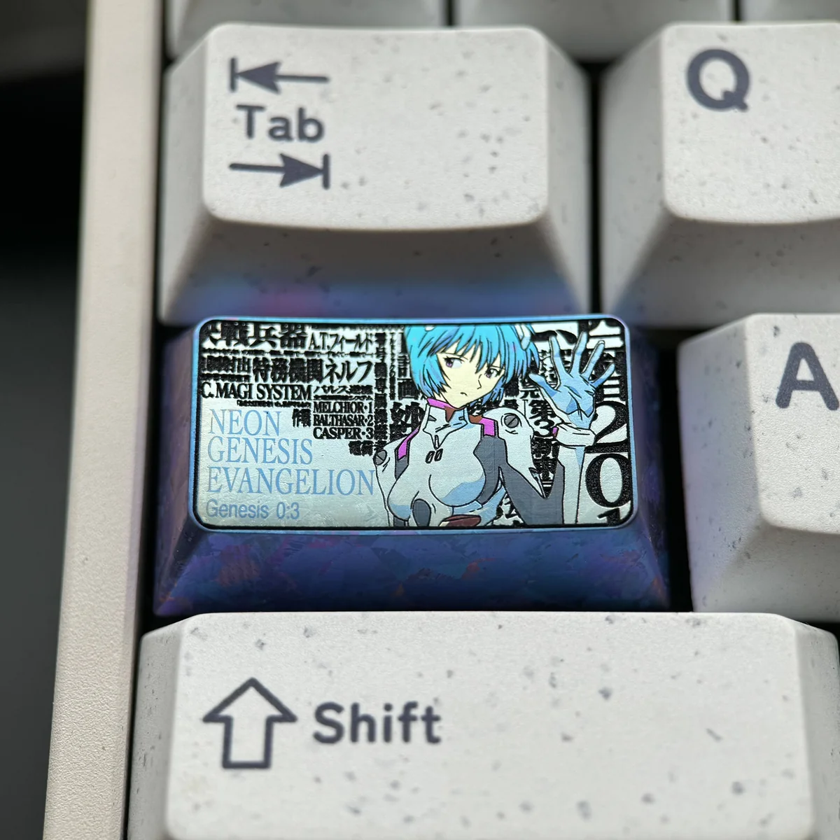 Multi-angle view of the Rei Ayanami anime keyboard cap, highlighting its premium titanium build and precise character engraving.