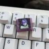 Premium handcrafted Reze titanium artisan keycap, showcasing dynamic Chainsaw Man character design and sleek finish from various perspectives.