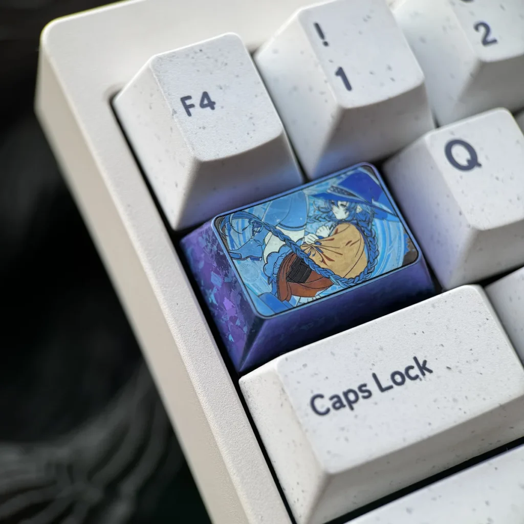 Close-up of the Roxy Migurdia gaming keycap, highlighting the artisan metallic sculpt and anime details.